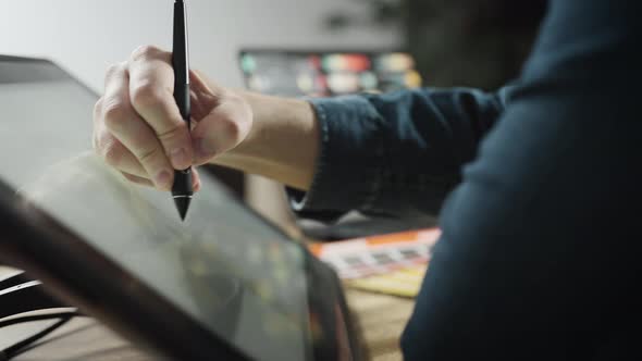 Experienced Professional Designer Working on an Interactive Graphics Tablet alt