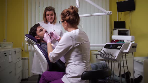 Nurse Using UV Lamp After Dental Filling Procedure alt