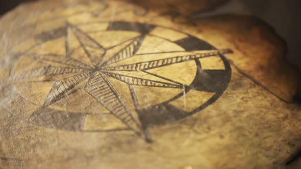 Old, worn, detailed, handmade treasure map on a cartoon tavern table close-up.4K alt