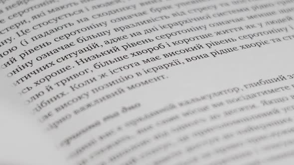 Turning Pages of a Book CloseUp Slow Motion alt