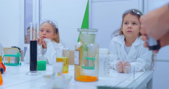 Children Studing Chemistry in School Laboratory alt