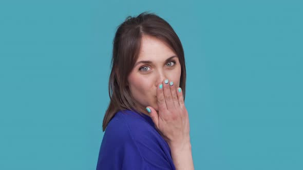 Horizontal Portrait of Cheerful Woman Playfully Posing on Camera Giving Air Kiss Being Flirty alt