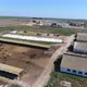 Aerial Shot of Cowshed with Cattle and Silo Storage with Bulldozers in Summer  - VideoHive Item for Sale