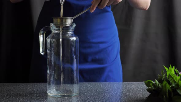 Cooking orange lemonade in the kitchen alt