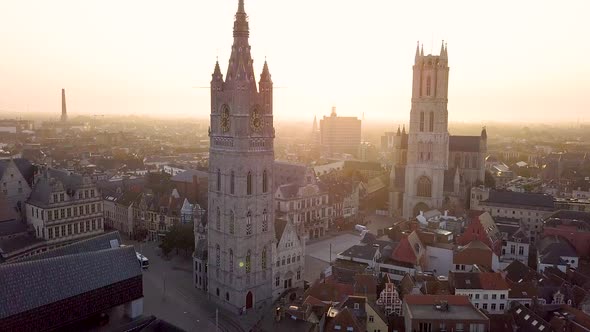 Pan Up shot of Old Bell Tower. Aerial shot Het Belfort Van Gent, Ghent, Belgium alt