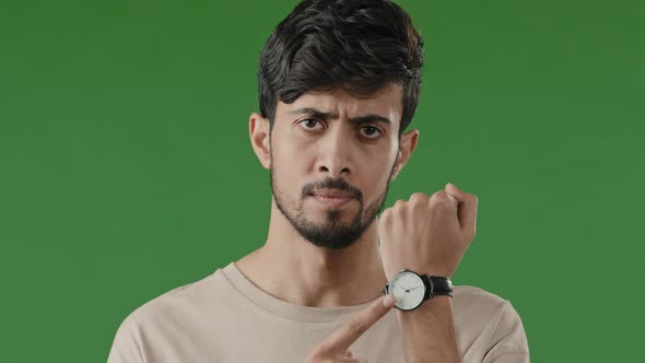 Portrait Serious Indian Young Man Standing Over Green Background Angry Nervous Male Shake Head Close alt
