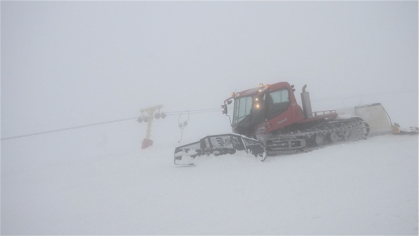 Snowcat and Skiers On Slope 2