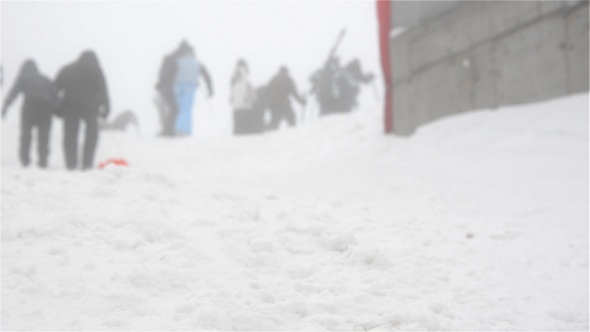 People Walking In Snow