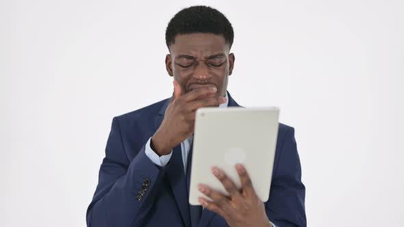 African Businessman Reacting to Loss on Tablet on White Background alt