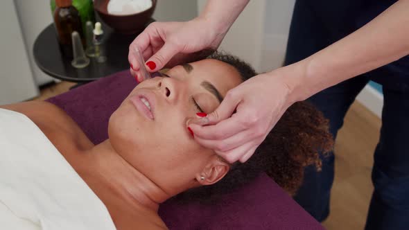 Beauty Specialist Doing Facial Massage with Suction Vacuum Cups Indoor alt