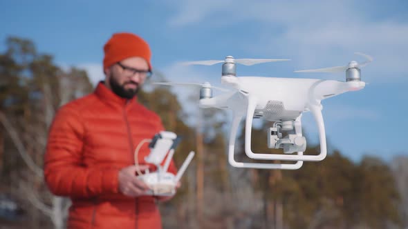Operator Makes an Areial Photo Using a Drone Copter in Winter