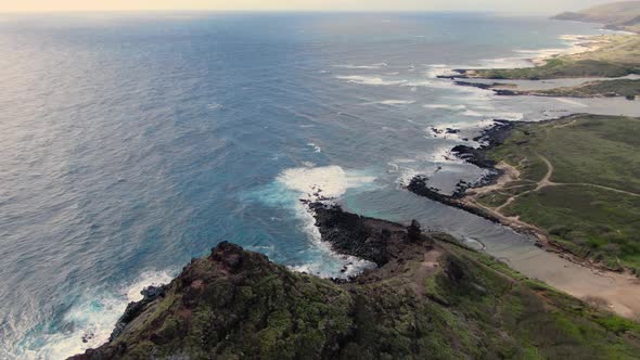 drone panorama around a secret beach on oahu hawaii alt