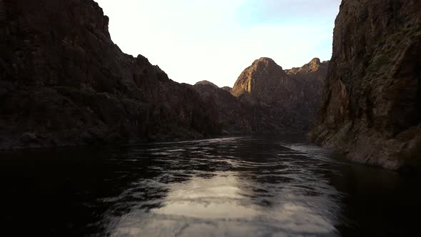 4k Aerial view from drone flying over the Colorado River with views of beautiful red rocks alt