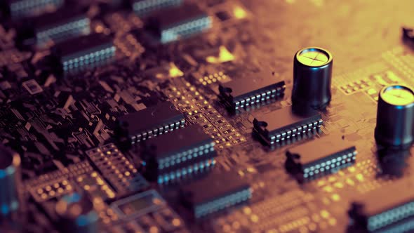PCB or printed circuit board with microchips and capacitors. Loopable video. 4k alt