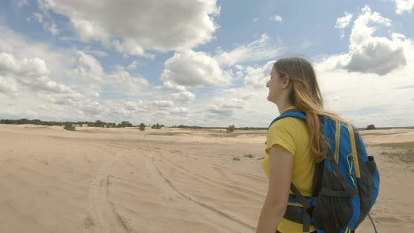 Young Girl Hiking in Dunes. Slow Motion. alt