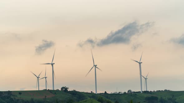 Footage B-roll timelapse power farm wind turbine while sunset time