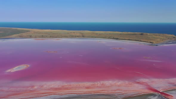 Aerial View of Pink Lake Near Black Sea in Crimea alt