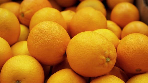 A Lot of Yellow Orange Closeup Panning on a  Background in Store for Buyer.