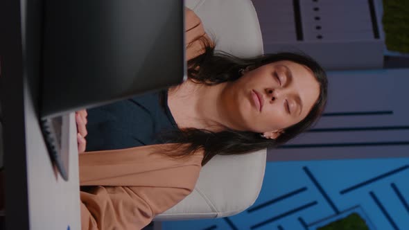 Tired Overworkes Businesswoman Sleeping in Startup Company Office on Desk Chair alt