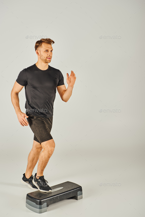 Power stride young athlete on stepper Stock Photo by LightFieldStudios