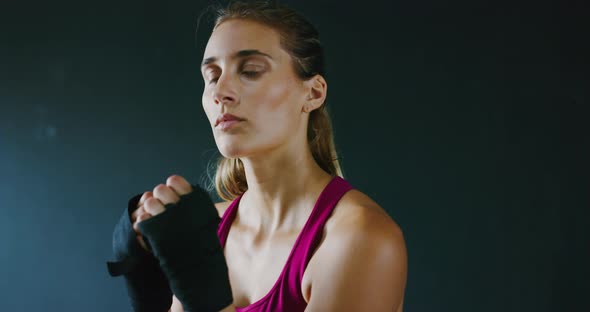Athletic Woman Training Kickboxing in the Gym alt