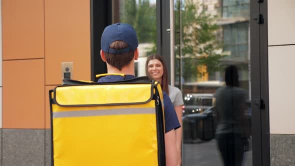 Positive Food Delivery Man Courier with Thermal Backpack Deliver Order Woman alt