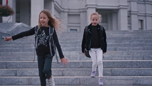 Slow Motion of School Kids Getting Down From Staircase at School alt