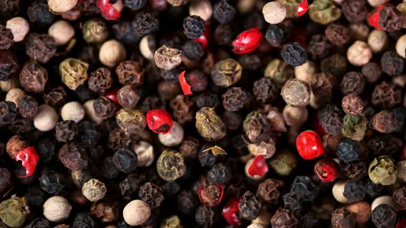 Super Slow Motion Shot of Moving Color Pepper Background at 1000Fps alt