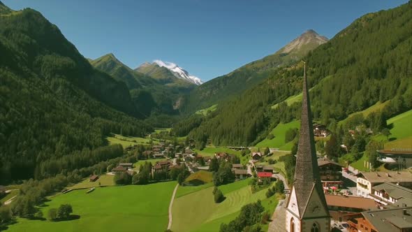 Beautiful spire of St Vincent church in Heiligenblut in the Alps alt