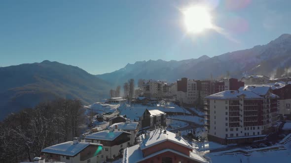 Aerial View of Modern Mountain City at Sunny Winter Day Calm Landscape From Bird Eye View alt