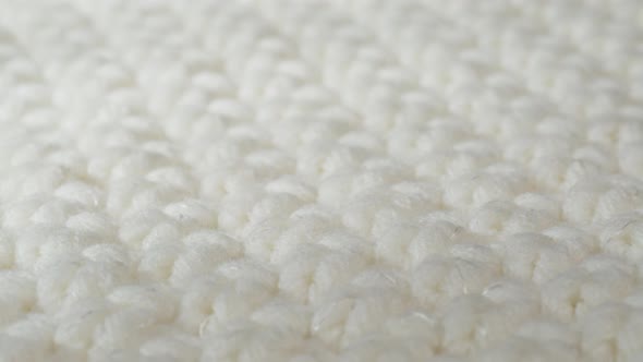 White Knitted Cloth Light Woolen Clothes Fabric Closeup Woven Textile Background alt