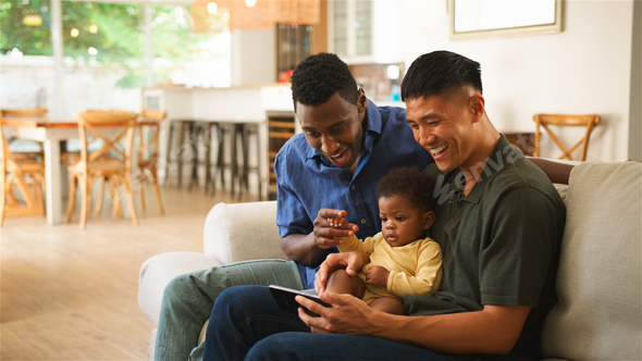 Diverse Same Sex Male Couple Family Enjoying Quality Time Together  