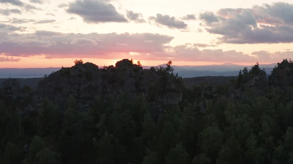 Aerial Footage of Natural Rocks on a Sunset with Sun Hiding Behind