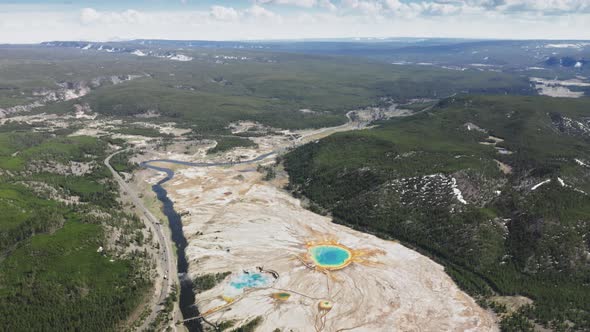 Ancient Super Volcano Caldera Landscape with Steaming Colorful Blue Geyser Lakes alt