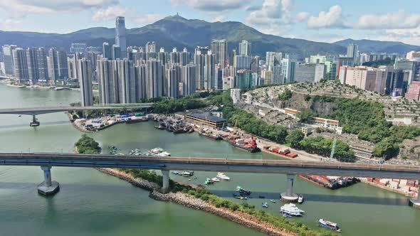 MTR Airport Express crossing the bridge in Tsuen Wan, Hong Kong; aerial alt