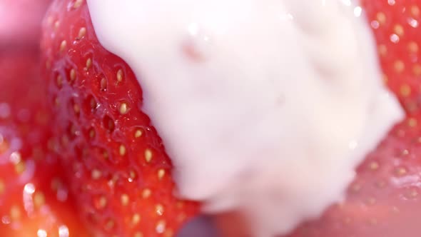Extreme Closeup Flowing White Thick Yoghurt or Cream Pouring to Fresh Big Strawberry Slow Motion alt