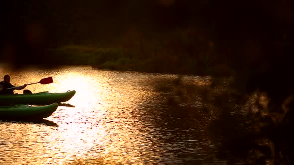Two Canoeists on the river alt