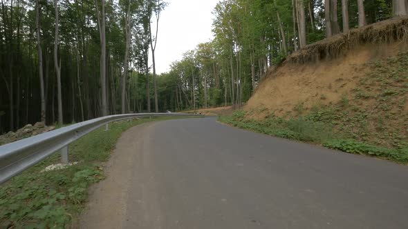 Three longboarders riding alt