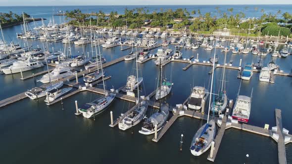 Ko Olina marina panorama, Sailing boats parked, Palm tree waterfront, Hawaii Aerial tracking alt