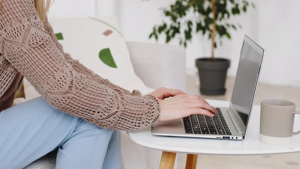 Closeup of Female Hands Fingers Typing on Modern Laptop Computer Caucasian Unrecognizable Woman alt