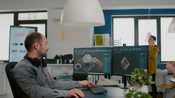 Mechanical Engineer Working on Computer Designing in CAD Software alt