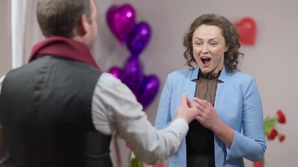 Excited Gorgeous Caucasian Woman Saying Yes to Man Proposing on Valentine's Day and Hugging Partner alt