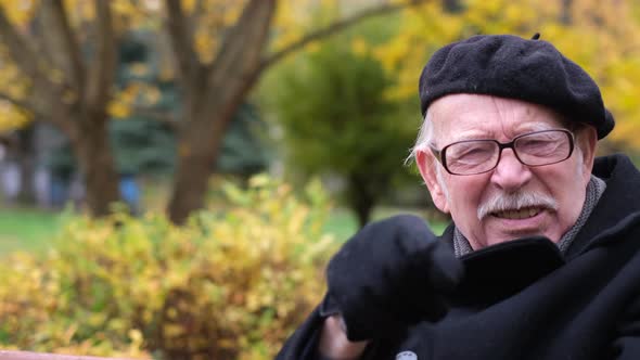 Aggressive Old Grandfather Quarrels He is Very Angry and Points a Finger at the Object alt