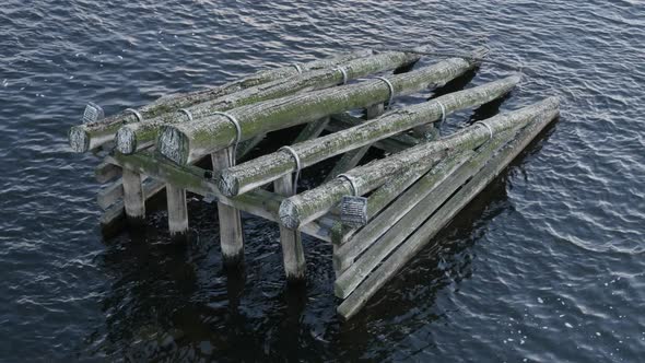 Wooden barriers in water of Vltava river near Charles bridge 4K 2160p 30fps UltraHD footage - Czechi