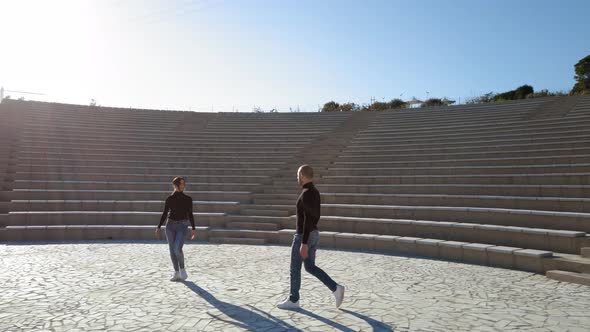 Man and woman couple dancers at outdoor theater alt