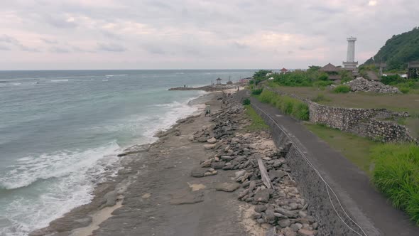 Aerial Footage of Pandawa Beach Embankment with Waves Crashing on Reef Unknown Silhouettes of alt