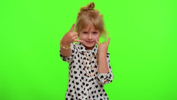 Overjoyed Kid Showing Rock n Roll Gesture By Hands Cool Sign Dancing Rejoicing in Success Win alt