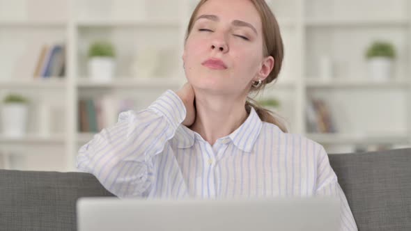 Portrait of Tired Young Woman with Laptop Having Neck Pain  alt