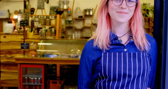 Female owner standing at the entrance 4k alt