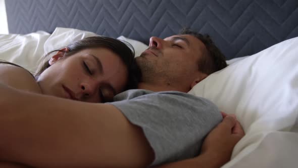 Cute couple sleeping together in bedroom at home 4k